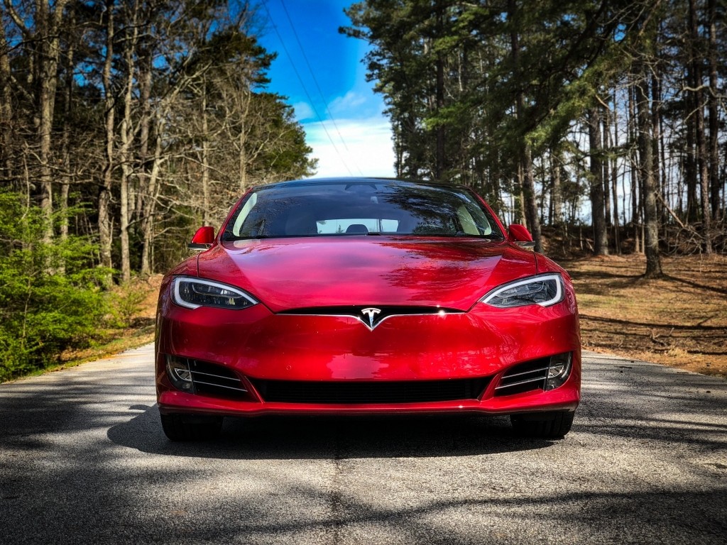 Red Tesla Model 3 on Country Road